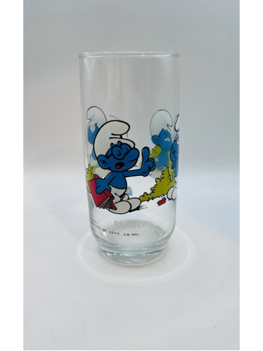 Vintage 1982 Brainy Smurf Glass 6” Tumbler Peyo Wallace Bernie & Co. Glassware